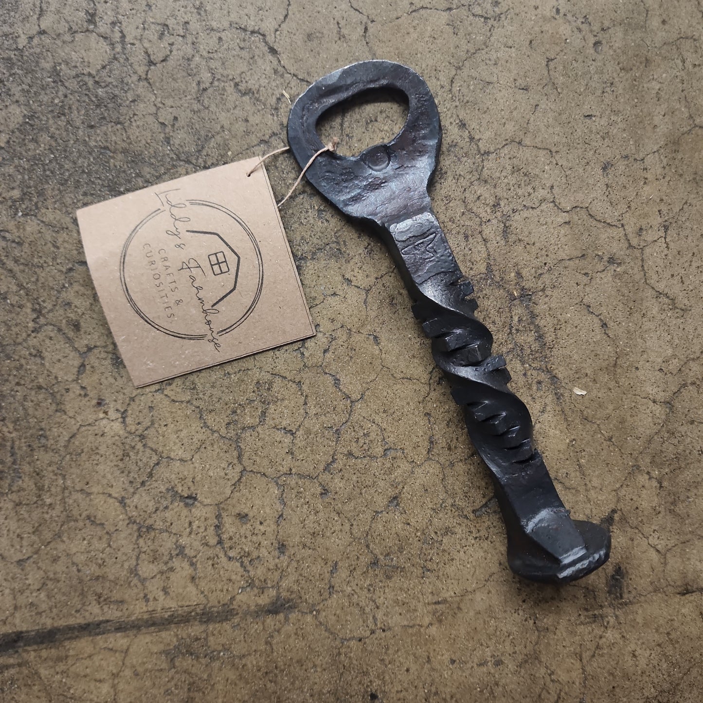 Hand Forged Bottle Opener with a Pineapple Twist Made from a Railroad Spike