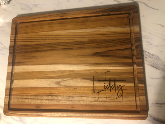 Blank teak charcuterie board showing natural wood grain